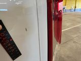 a sticker on the door of a white car