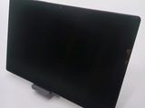 an image of a black laptop computer on a stand