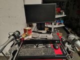 a desk with a computer and a keyboard on top of it