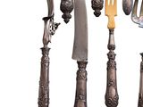 many different types of silverware on a white background