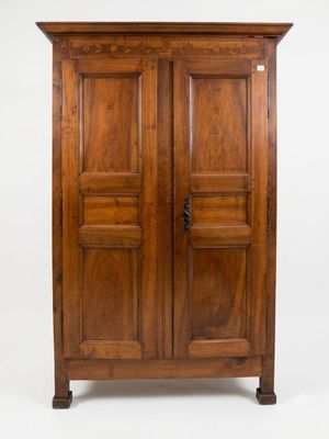 an old wooden armoire with two doors and two drawers