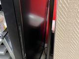 a television that is sitting on the floor next to a wall