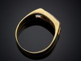 a gold ring with an oplite stone set in the center