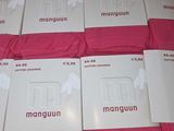 boxes of pink men ' s underwear are stacked on top of each other