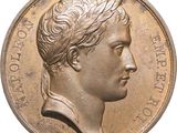 an image of a close up of a coin with a man ' s face