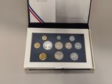 an open box of coins sitting on top of a table