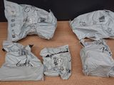 four bags of food sitting on a table next to each other