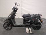 a scooter that is parked on a checkered floor