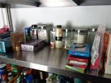 a metal shelf that has many different items on it