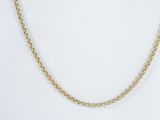 a gold chain necklace with pearls on a white background