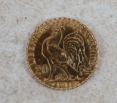 an image of a gold coin with a rooster on it