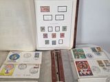 an open book with stamps on it sitting on a table
