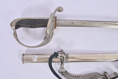 two swords and a chain on a white surface