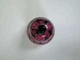 a glass vase with a flower inside of it on a table