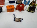 a lot of purses that are sitting on a table