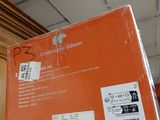an orange box sitting on top of a shelf in a store