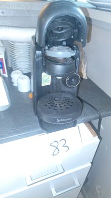 a coffee maker sitting on top of a kitchen counter