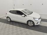 a picture of a white car parked in a garage
