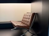 a chair that is sitting on a shelf in a room