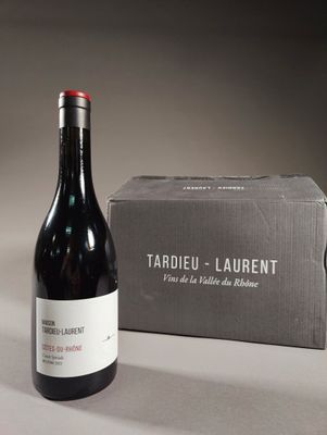 a bottle of wine sitting next to a box of wine