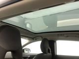 a view of the sunroof from inside of a car
