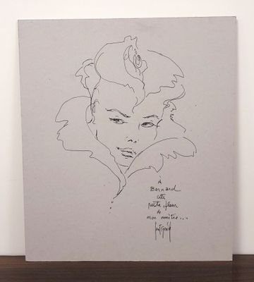 dessin représentant le visage d'une femme sur une feuille de papier, accompagné d'une citation écrite à la main