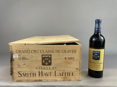 a wooden box with a bottle of wine next to it