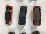 many different types of toy cars on display on a table