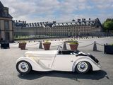 a white car that is parked in front of a building