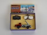 a box with a toy truck and other items in it