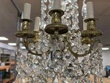 a chandelier that is sitting on a table in a store