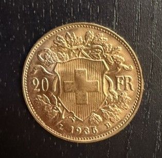 l'image d'une pièce d'or portant une croix