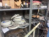 a lot of wires on the shelves in the room