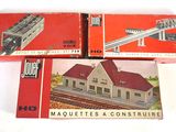 three boxed model trains sitting on top of each other