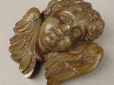 a statue of a woman with wings on a table
