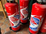 three fire extinguisors sitting on the floor next to each other