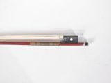 a red and white violin bow and a black and white violin stick