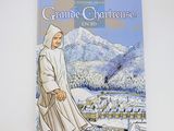 the front cover of a children ' s book with a picture of a nun standing in front of a snowy