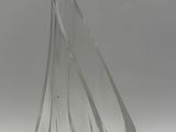 a clear glass vase that is on a table