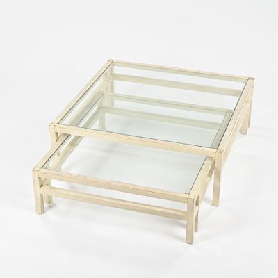 glass coffee table with wooden legs and a glass top on a white background