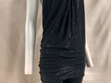 the mannequin is wearing a black top and leggings