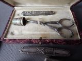 a pair of scissors and a pair of scissors in a case