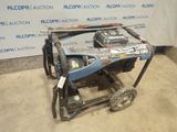an image of a blue and black generator sitting on top of a cart