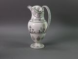 a white vase with a black and white design on it