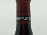 a bottle of wine that is sitting on a table