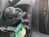 a car key with a green tag attached to it