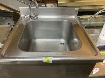 a stainless steel sink that is sitting on a counter