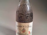 a bottle of wine with a skull and crossbone on it