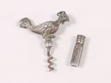 a bottle opener with a bird on it next to a bottle opener