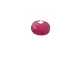 an oval ruby stone with a white background